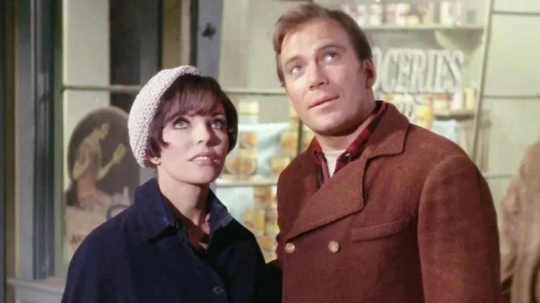 Edith and Kirk looking towards the sky in